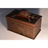 A Colonial folk art box, the loose-fitting cover boldly carved with a turtle,