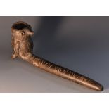 A 'pre-Columbian' earthenware peyote pipe, the bowl modelled as a stylized blade, 16.