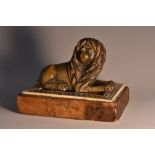A 19th century Anglo-Indian horn carving, of a recumbent lion,
