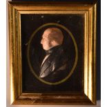 A 19th century wax portrait, of a gentleman, wearing a black coat, bust length, facing to dexter, 8.
