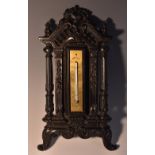 A 19th century French bois durci thermometer,