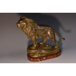 Charles Valton (1851 - 1918), after, a patinated bronze, of a lion, roaring across the Savanna,