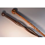 Tribal Art - a Zulu hardwood status staff or stick, globular head, open-twist shaft, 98.5cm long, c.
