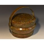 A Chinese/Tibetan bronze circular brazier, swing handle, pierced cover.