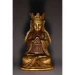 Chinese School, a gilt bronze Buddha, seated, in meditation,