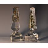 A matched pair of late 19th century cut glass triangular desk obelisks,