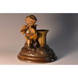 A 19th century French brown patinated bronze table vesta, cast as a putti, allegorical of summer,
