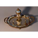 A French champleve enamel inkstand, urnular well with hinged cover, mirrored base with pen rest,