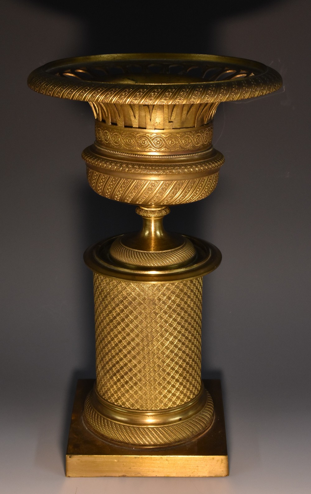 A 19th century French Empire design gilt-brass campagna shaped comport,