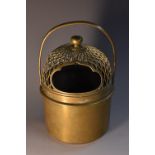 A Japanese bronze cylindrical brazier, pierced domed cover, bud finial, swing handle, 15.