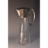 A late Victorian EPNS-mounted claret jug, influenced by the designs of Dr Christopher Dresser,