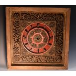 A Middle Eastern hardwood clock or sundial, circular register picked out in red,