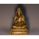 A late 19th/early 20th century gilt bronze DharmaChakra Buddha,