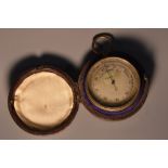 A 19th century brass travelling pocket aneroid barometer, 4.5cm silvered register, 7.