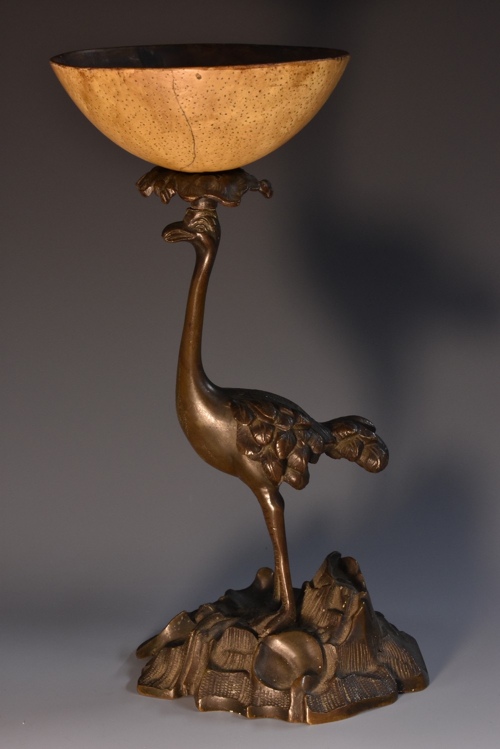 A 19th century dark patinated bronze novelty goblet, cast as an ostrich,