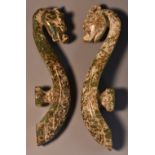 A pair of Chinese hardstone buckles, carved in the archaic taste with dragons and scrolls,