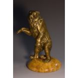 A 19th century gilt bronze novelty inkwell, cast as a dancing bear, his head hinged as the cover,