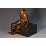 A novelty cold-painted casket, cast as an iron bound Nuremberg rectangular treasure chest,