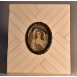 English School, late 19th century miniature, of a lady wearing a blue bonnet, on ivory,