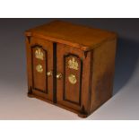 A late Victorian oak novelty humidor or table cabinet, as a safe,