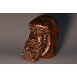 A folk art novelty inkwell, carved as the head of a bearded gentleman, hinged cover, 7.