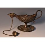 A 19th century Grand Tour dark patinated chamberstick, as a Roman lamp, hinged cover, scroll handle,