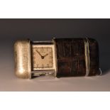 An Art Deco Dunhill rounded rectangular purse timepiece, of vesta form, Ebel Watch Co.