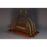 A late Victorian oak and brass correspondence rack,