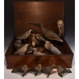 A collection of 19th century Folk Art softwood decoy birds, various owls, game and water birds,