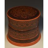 A 19th century Indian lacquer three-tier stacking box and cover,