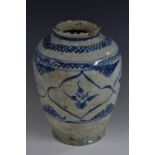 A Middle Eastern ovoid vase, painted in the Islamic taste in underglaze blue with stylised leaves,