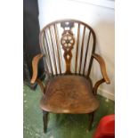 An elm wheelback carver chair