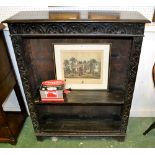 A Victorian carved oak open bookcase, c.