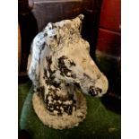 A reconstituted stone garden ornamental sculpture, horses head,