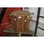 A large Victorian copper water urn and cover with brass tap