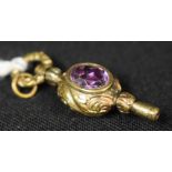 A 19th century carnelian and amethyst set pocket watch key