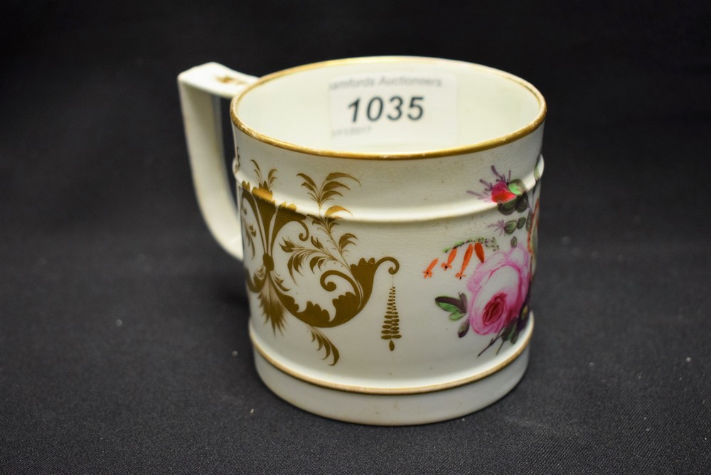 A Derby mug, painted with colourful summer flowers, the ground with gilt scrolls,