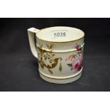 A Derby mug, painted with colourful summer flowers, the ground with gilt scrolls,