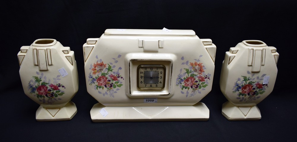 A French Art Deco clock garniture, square dial,