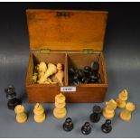 A carved wooden Staunton pattern chess set,