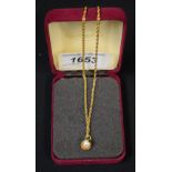 A 9ct gold pendant and chain,