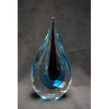 An Italian Murano glass desk weight, as a flattened ovoid teardrop or splash of water,