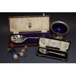 Silver christening spoon, cased; white metal wine stopper,