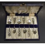 A set of six cased white metal Art Nouveau teaspoons