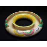 A Clarice Cliff Rhondanthe pattern posy ring, brightly decorated with stylised flowers in green,