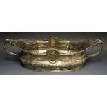 A Neo-classical silver plated oval table centre, the two handles cast with stiff acanthus leaves,