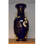 A large 19th century Chinese two handled dragon vase,