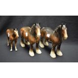 A Beswick model, of a shire horse, standing, four square, 27cm long, printed mark; another,