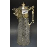 An Edwardian cut glass claret jug, EPNS mounted with lion scroll handle,