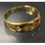 An 18ct gold signet ring, set with three diamonds, 4.